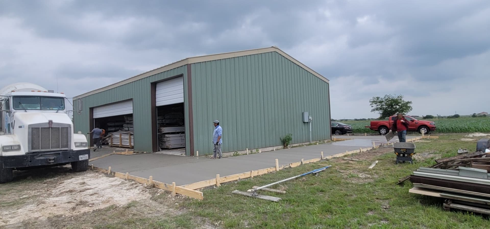 New Concrete Slab Poured Outside a Working Barn image