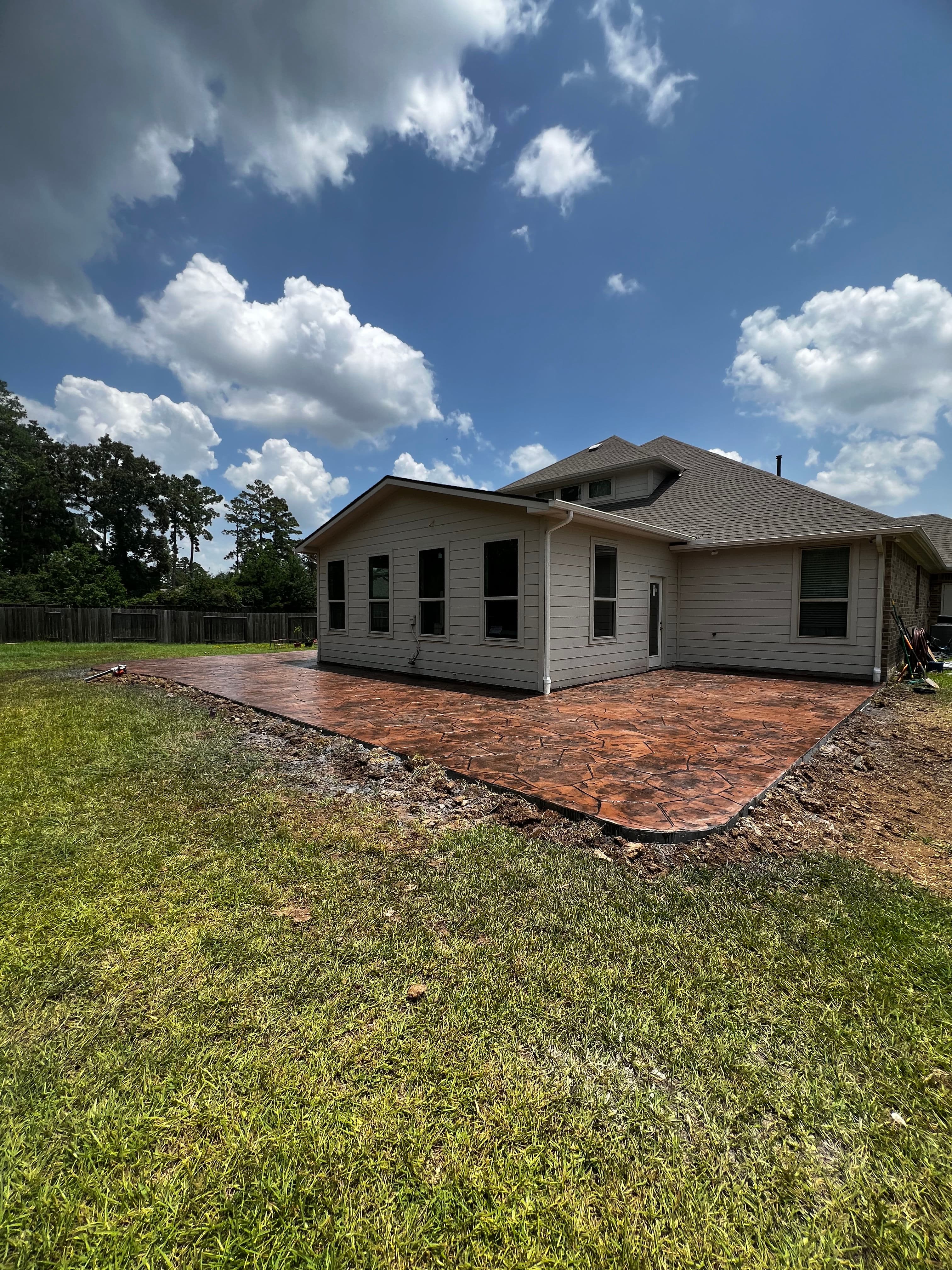 Project Backyard Goes From Bare Dirt to Stunning Stamped Concrete Patio image