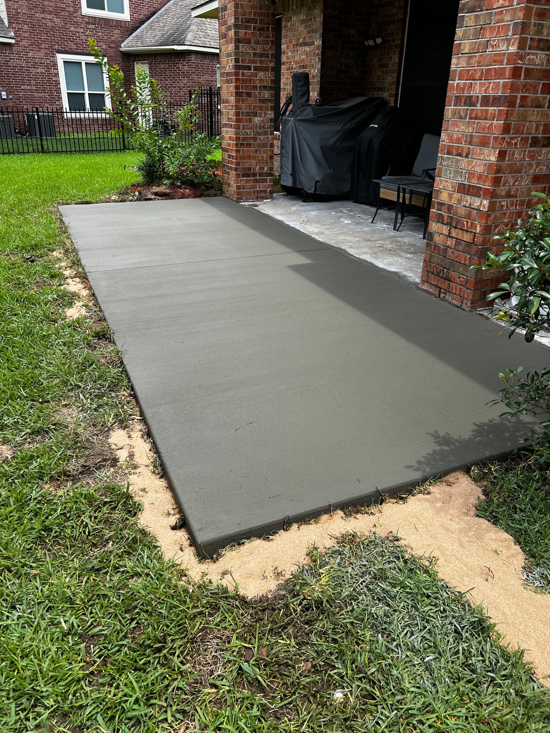Cracked Patio Demolished and Replaced With Fresh Concrete Slab image