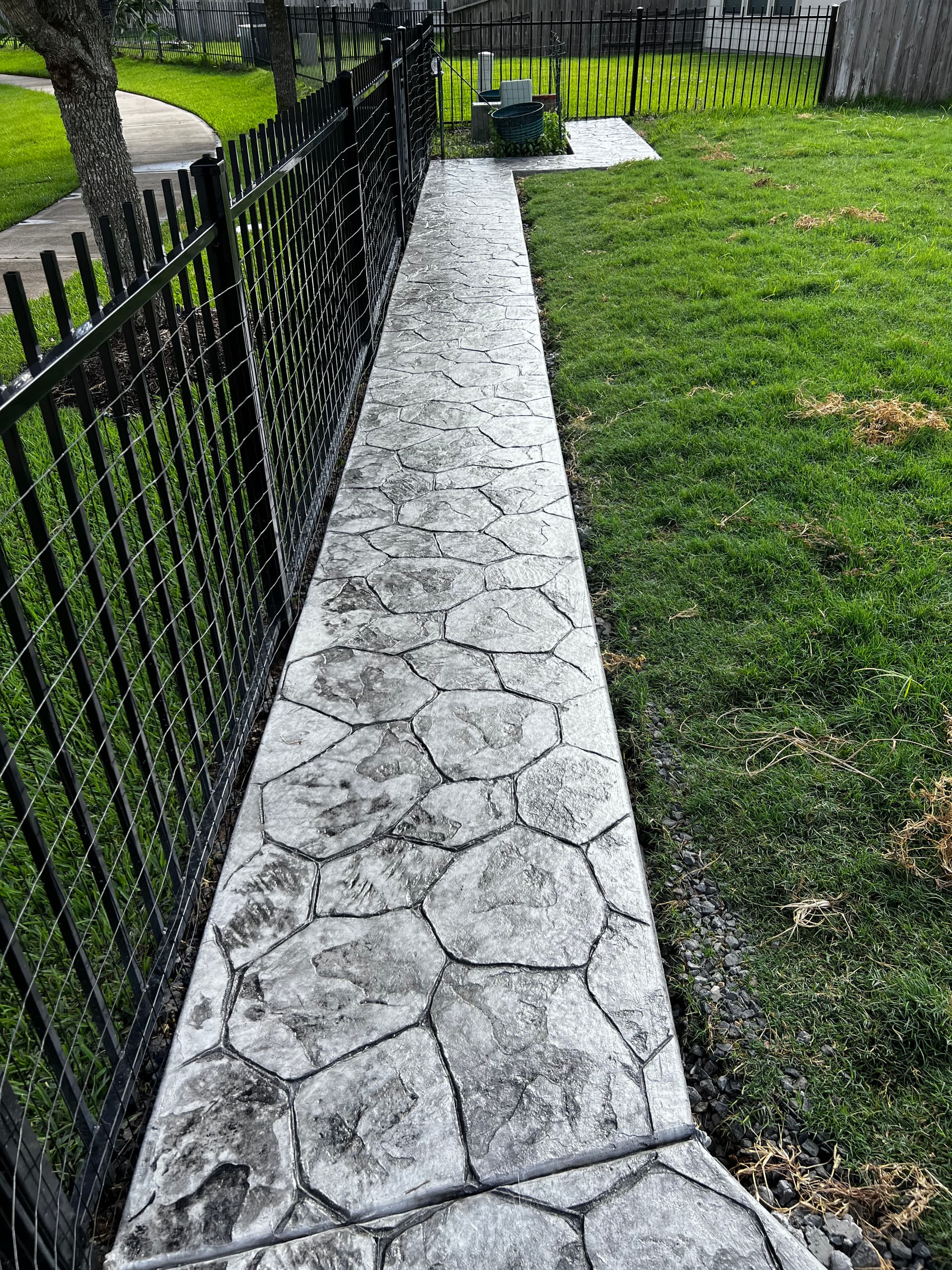 Gallery photos for Stamped Concrete Walkway That Stopped a Dog From Digging Under the Fence: Image #8