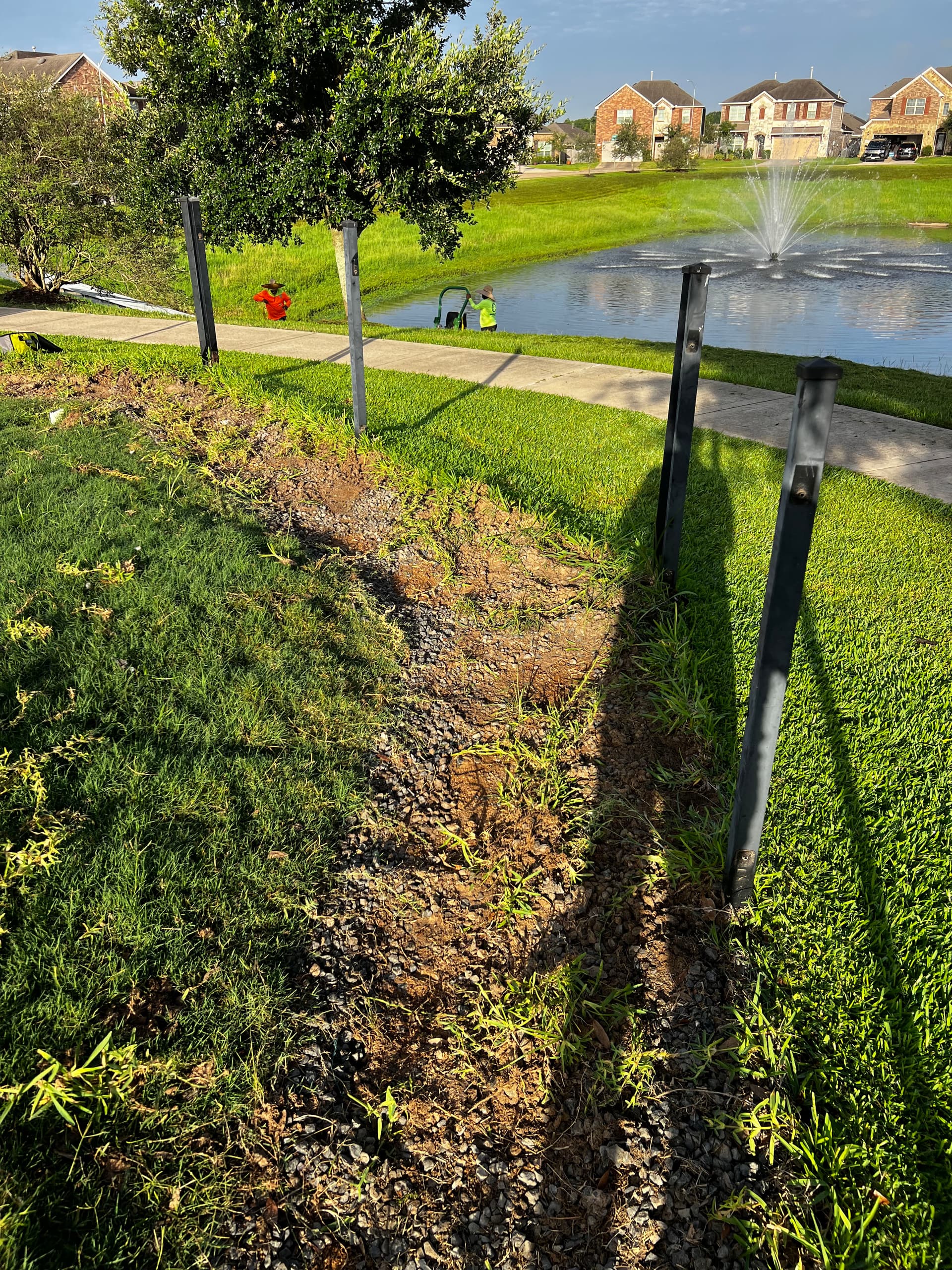Gallery photos for Stamped Concrete Walkway That Stopped a Dog From Digging Under the Fence: Image #1