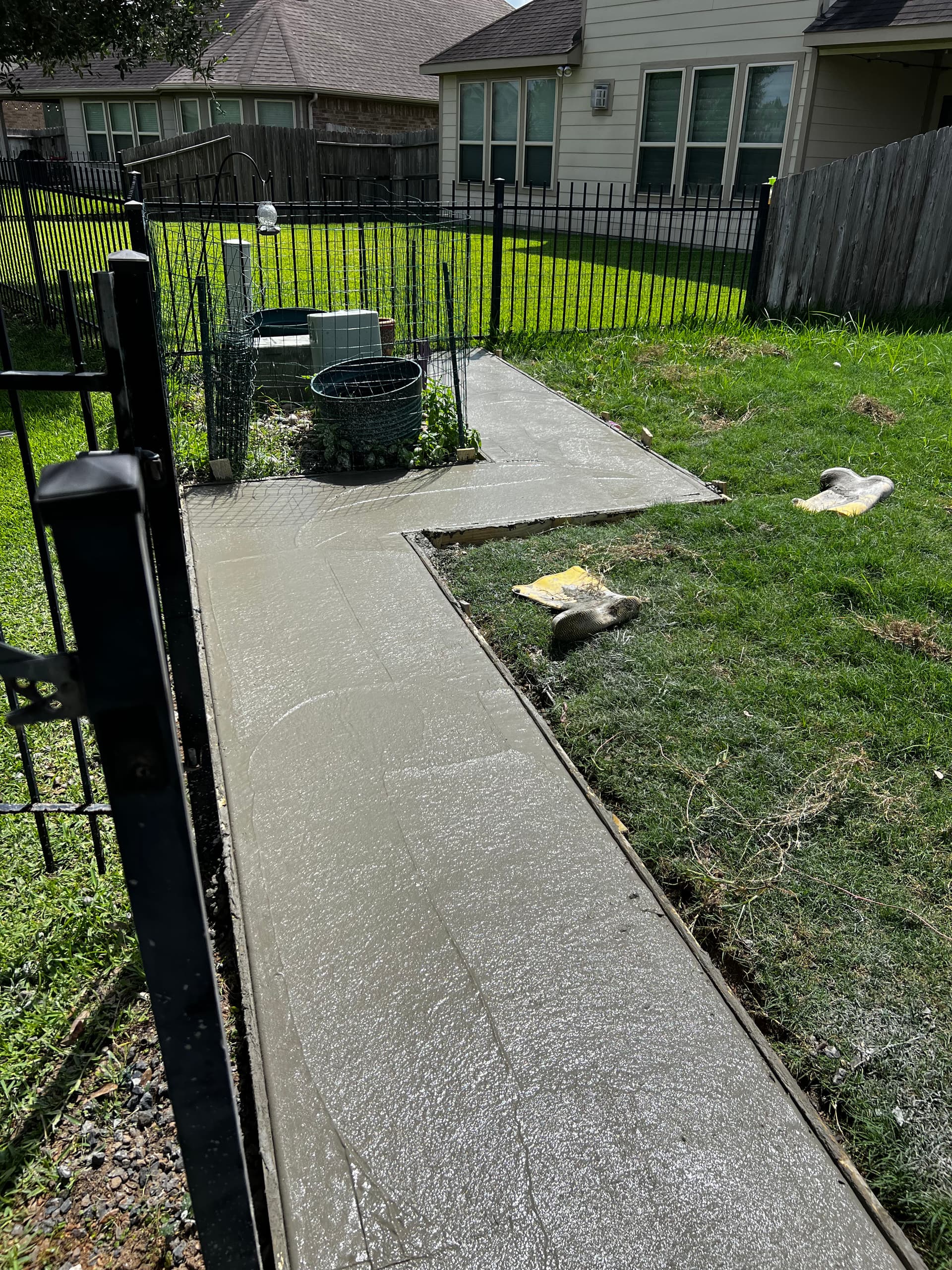 Gallery photos for Stamped Concrete Walkway That Stopped a Dog From Digging Under the Fence: Image #4