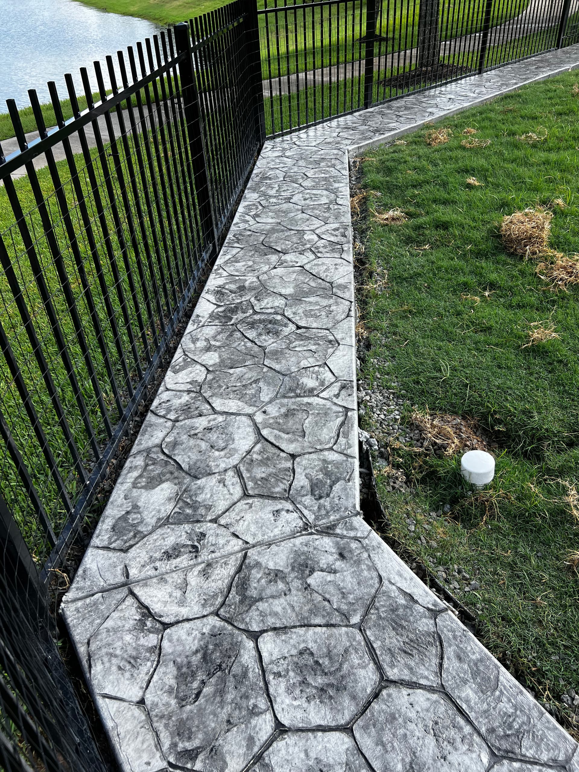 Gallery photos for Stamped Concrete Walkway That Stopped a Dog From Digging Under the Fence: Image #7