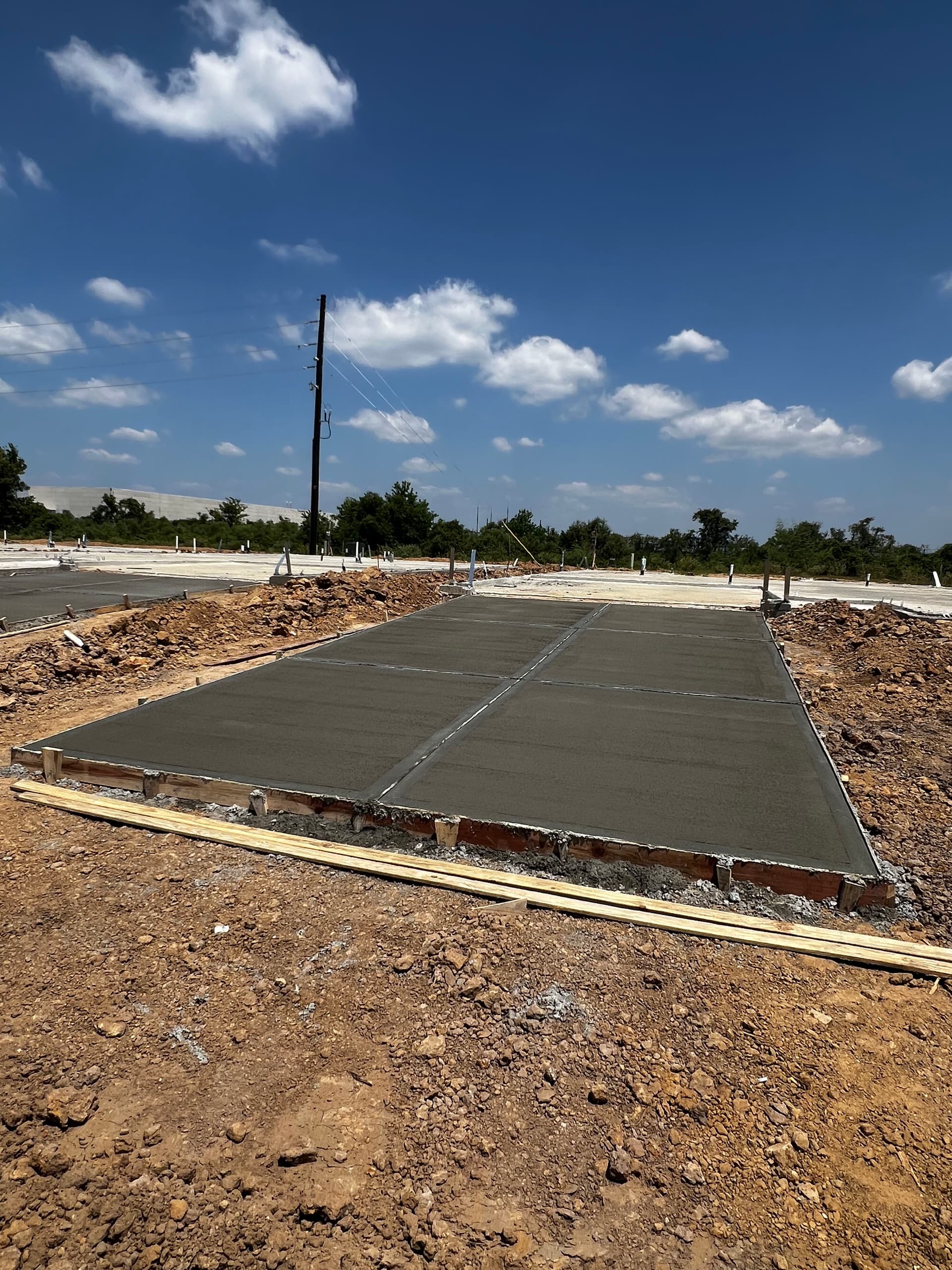 Pouring Concrete Slabs and Sidewalks for a Growing Neighborhood image